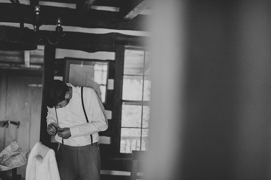 groom getting ready in cabin