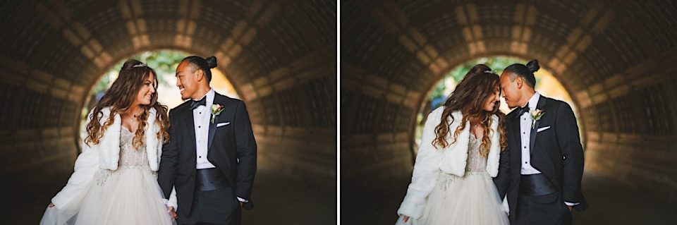 Bride and groom smiling and leaning close to each other at the John Boathouse, displaying affection in their wedding attire.