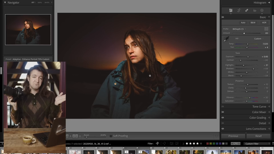 A person in a teal jacket looks to the side amidst the warm glow of dusk, capturing serene beauty with their Nikon Z8, showcasing its performance in real-world use.